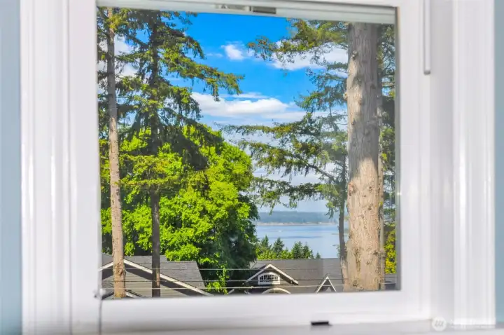 This water view is peek-a-boo framed by the window in Bedroom 2