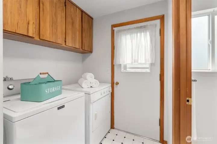 Laundry room with yard access.