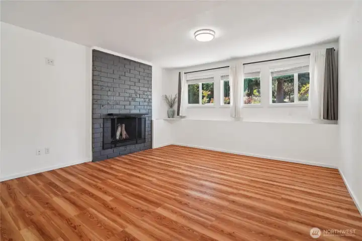 Recroom downstairs  with fireplace.