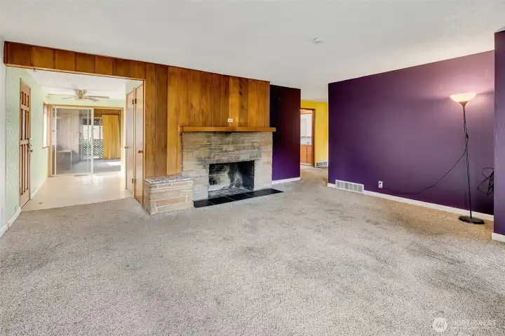 Living room with a wood burning fireplace