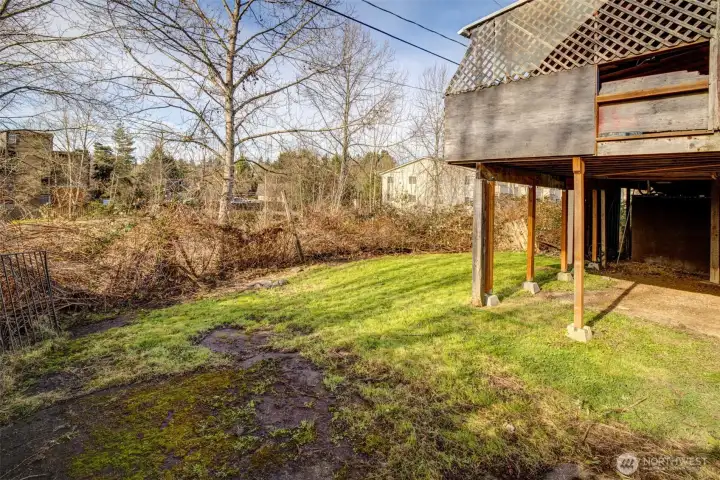 House is on a small hill - private covered deck