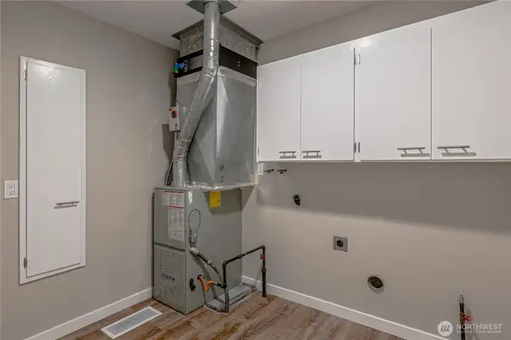 Utility Room washer and dryer are being stored in the garage.