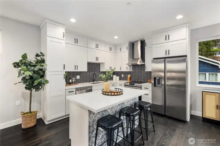 Kitchen with Samsung appliances and custom white shaker cabinetry