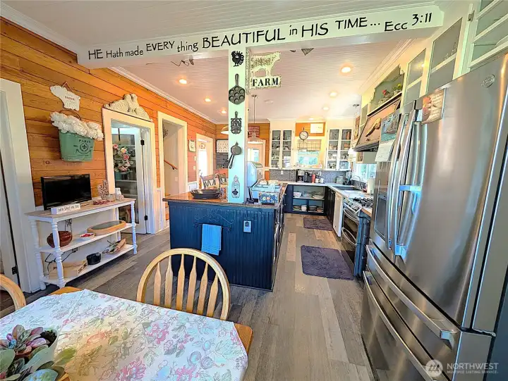 Breakfast nook off end of fully appointed kitchen
