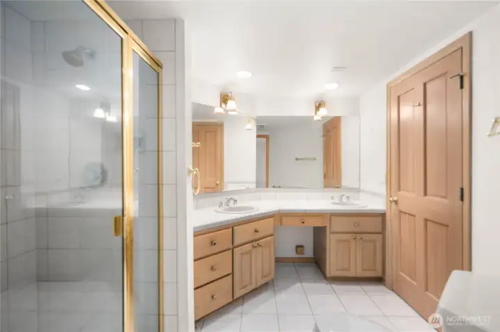 Primary bathroom with shower and dual vanity