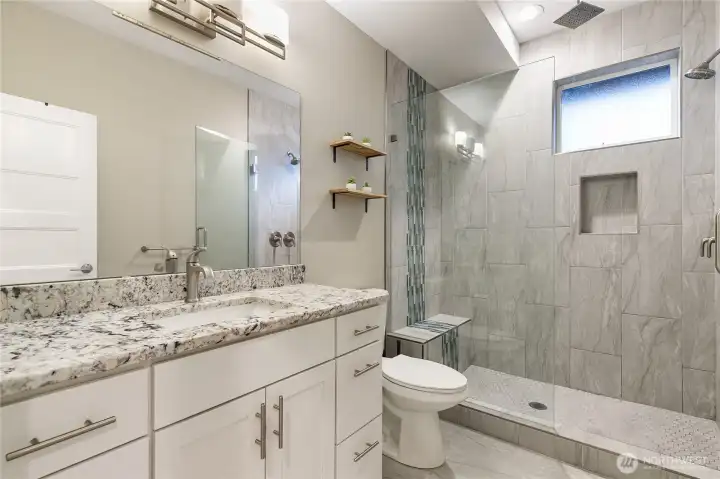 Full bathroom with  floor-to-ceiling tiled shower
