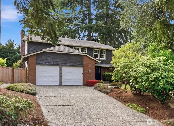 Attached 2-car garage and spacious driveway offer excellent parking and storage flexibility