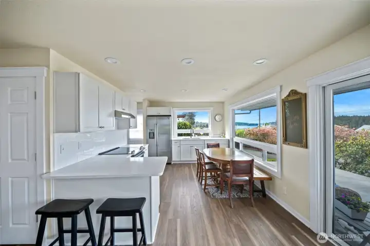 Revamped kitchen-its all new. Quartz counters, stainless appliances, crisp cabinetry and eating bar
