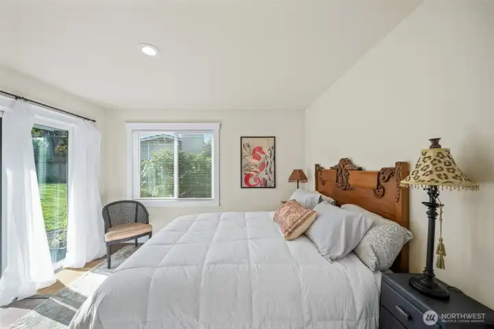 Bedroom #2 with a slider to the private rear yard
