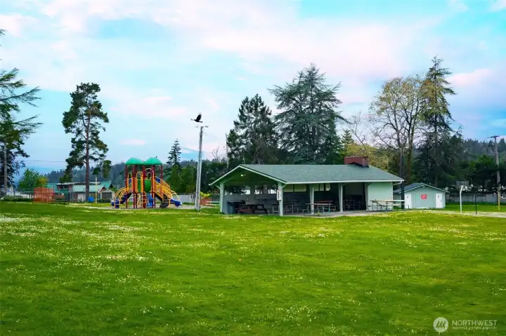 This covered picnic space can be reserved for parties. Playground and community garden nearby