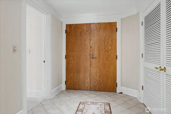 As you enter the double-door tiled entry, you immediately notice the lovely millwork, base and crown moldings and wood louvered doors with lever hardware.