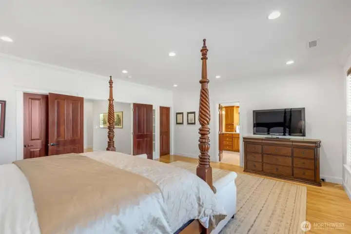 This room is very large- this is a tall King size bed and it barely makes a dent in the space!
