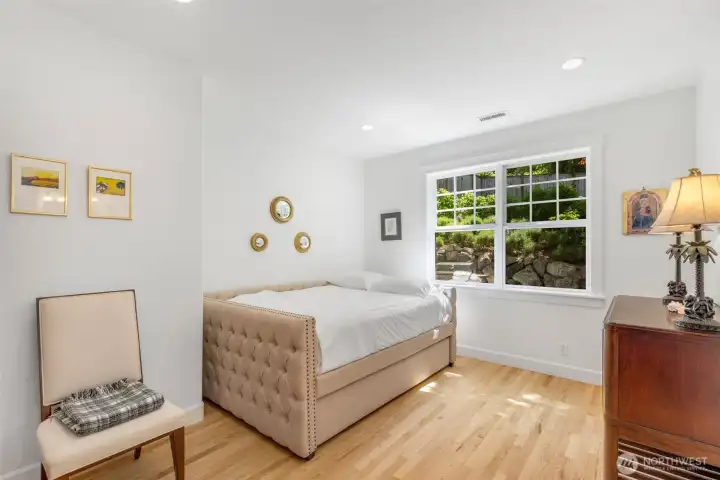 Second bedroom on this level faces the beautiful back yard.