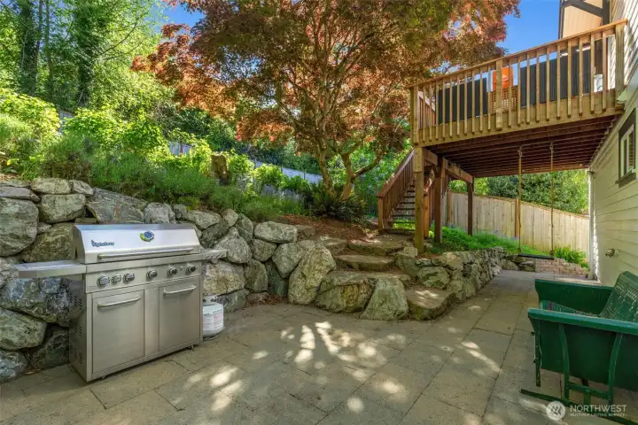 Lower patio seamlessly connects to the upper deck and backyard space!