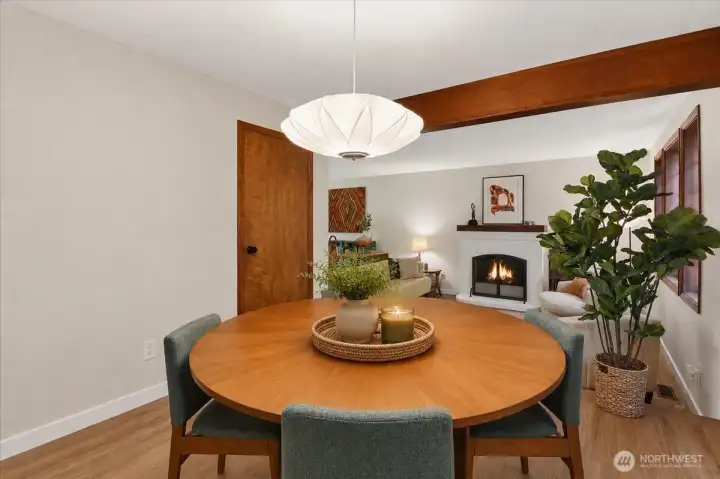 A look through the dining room back towards the living room. Featuring a nice exposed wood beam. A look through the dining room back towards the living room. Featuring a nice exposed wood beam.