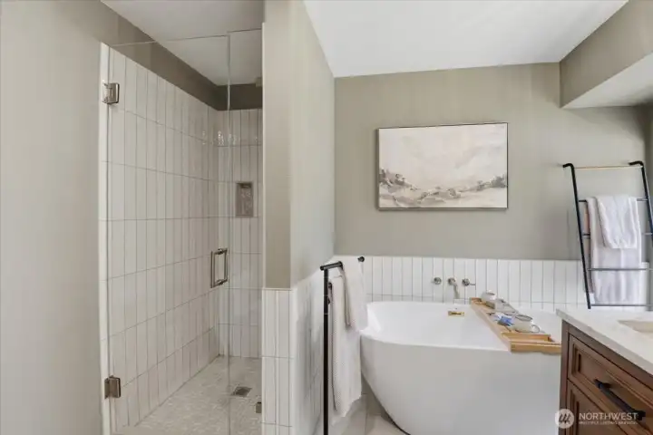 Primary bathroom showing tile shower and frameless glass shower door. Primary bathroom showing tile shower and frameless glass shower door.