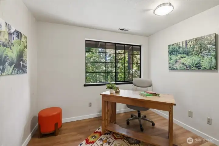 Upstairs den with laminate flooring. Upstairs den with laminate flooring.