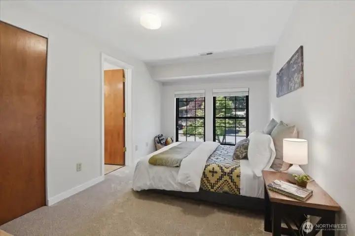 First bedroom with new carpet that shares a Jack and Jill bathroom. First bedroom with new carpet that shares a Jack and Jill bathroom.
