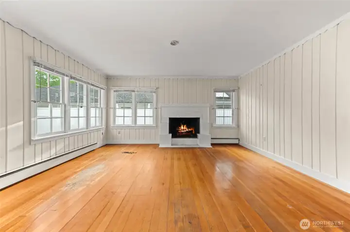 Living room with fireplace and tons of natural light from gorgeous windows