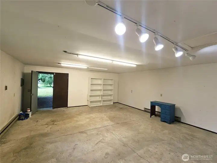 Shop w poured concrete floor and 2 covered carport parking spaces Shop w poured concrete floor and 2 covered carport parking spaces