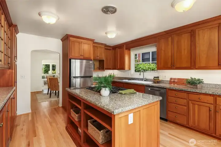 The kitchen flows into the dining and living rooms