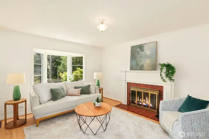 Sunny, spacious living room with large bay windows