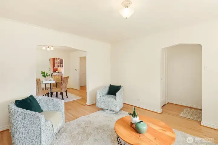 The living room and dining room in the background