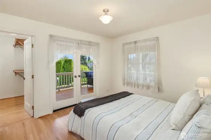 Bedroom 2 on main floor with direct access so the wraparound front porch
