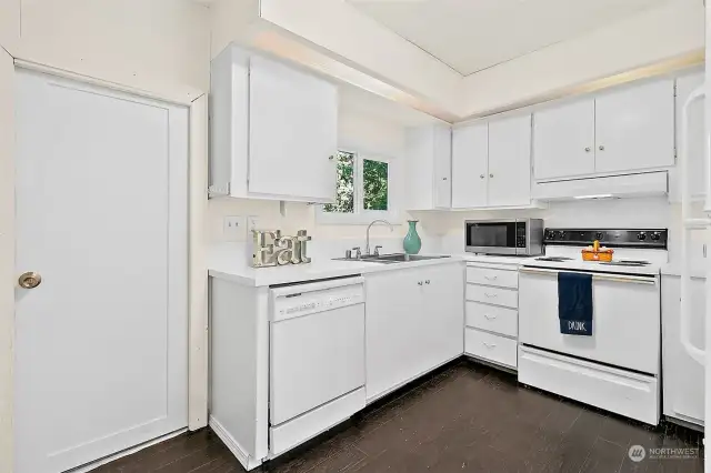 Kitchen will not disappoint with a back door leading to the side yard.