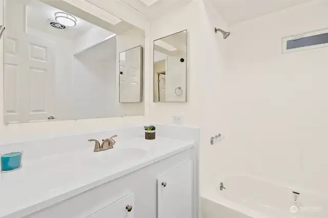 Guest bathroom off of hallway across from second bedroom.