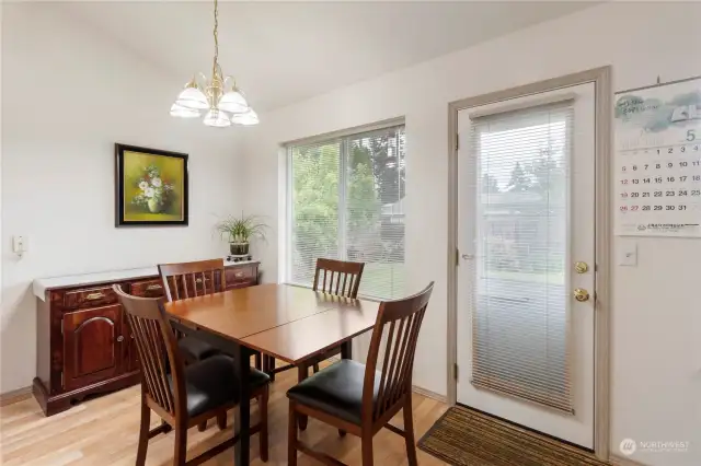 Eating area off Kitchen with door to the beautifully landscaped backyard!