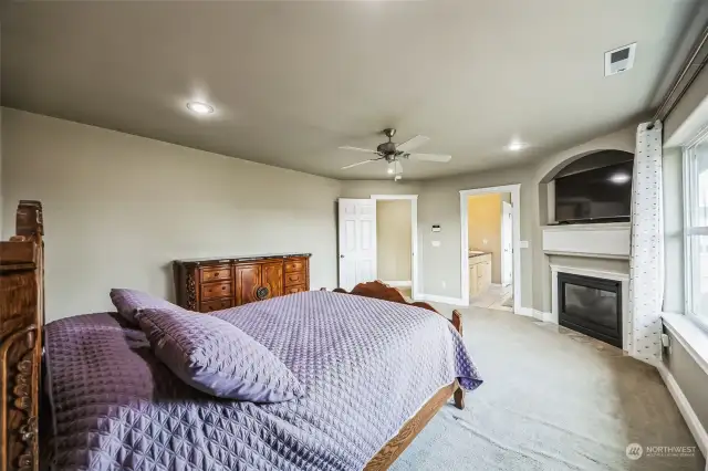 Upstairs primary bedroom with gas fire place