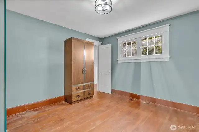 Upstiars bedroom with back walk in storage space.