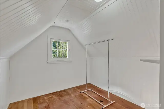 Walk in storage space with window overlooking creek