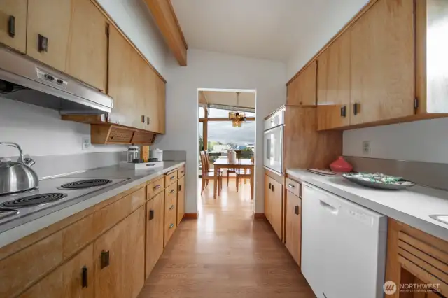 Galley kitchen with plenty of storage space.