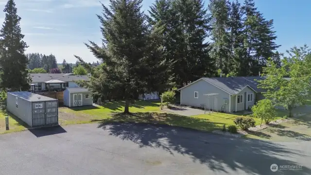 Spacious Living: Set on over 0.6 acres of meticulously landscaped flat land, this property offers space and serenity.