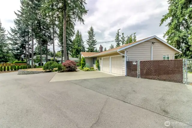 Lots of parking for either large gatherings - or space to add another garage if needed.