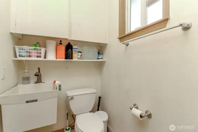 Half bath by back door & hot tub.
