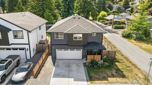 Corner lot with ample off street parking in driveway & gravel pad.