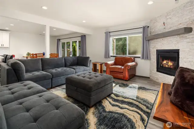 Open concept living space with seamless flow between living room, dining room & kitchen.