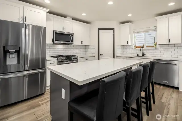 Bright, modern kitchen with island seating.