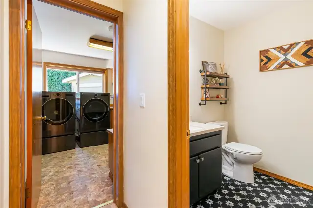 1/2 bath in the hallway leads to laundry room