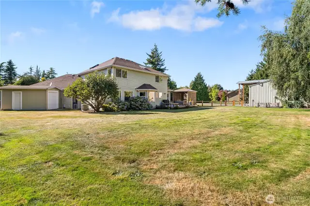 Lawn shed to the left and large back yard.