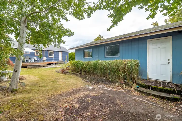 House and garage sit on a large lot