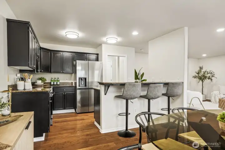 Kitchen with eating bar and granite counters