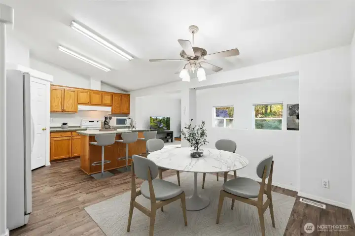 The dining area is bright and inviting, with views into the family room that keep you part of every moment.