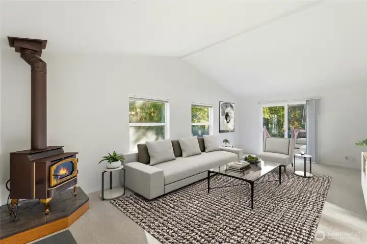 The family room is a true heart-of-the-home space, highlighted by a charming corner fireplace and a slider that opens to the expansive back deck and yard.