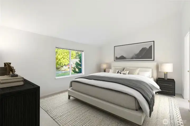 Private primary suite with ensuite and large walk-in closet.