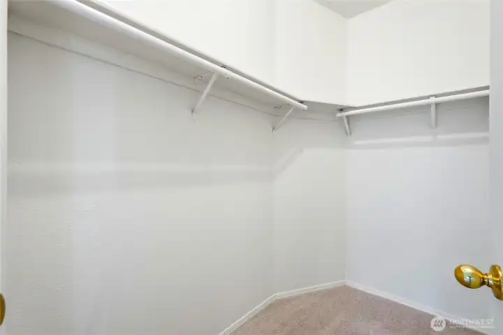 The generous walk-in closet is sure to please anyone who loves extra storage and organization.