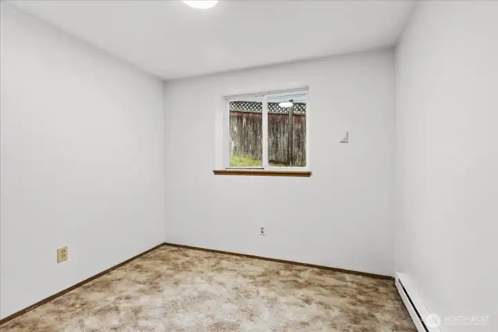 Bedroom down hallway by 3/4 bath
